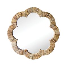 a mirror that is made out of wood and has a flower shaped design on it