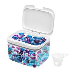 a lunch box with two containers and one container filled with blue, purple, and white food