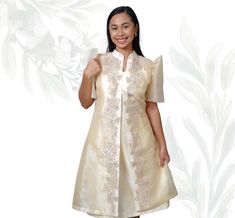 Organza Filipiniana Barong with Inner Dress Experience the elegance of Filipino tradition with the Organza Filipiniana Barong with Inner Dress, a sophisticated ensemble that merges classic design with contemporary style. This beautiful outfit features a sheer organza Barong, renowned for its light and airy texture, paired with a matching inner dress for added comfort and modesty. The Barong is crafted from high-quality organza, showcasing intricate embroidery that highlights traditional Filipino Elegant Knee-length Ao Dai For Formal Occasions, Elegant Knee-length Ao Dai For Party, Elegant Short Sleeve Dresses For Eid, Elegant Short Sleeve Dress For Ceremonies, Elegant Short Sleeve Ceremony Dress, Traditional Knee-length Formal Dresses, Short Sleeve Dresses For Celebrations, Elegant Short Sleeve Dresses For Celebration, Elegant Short Sleeve Ao Dai For Festive Occasions