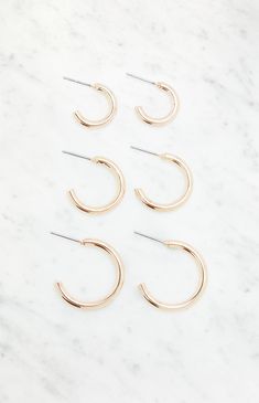 The LA Hearts 3 Pack Hoop Earrings are a versatile must-have for any jewelry collection. With three different sizes to choose from, you can mix and match to suit your mood and style. Perfect for adding a touch of effortless chic to any look, whether it's casual or dressed up.


	Set of three earrings
	Gold finish
	Post back closures Three Earrings, Slim Fit Cargo Pants, Diamond Cross, Jeans Kids, Kids Swimwear, Effortless Chic, Man Swimming, Women Accessories Jewelry, Hoodie Dress