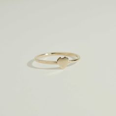 Add a touch of romance and elegance to your jewelry collection with our handcrafted Tiny Heart Ring. Made of high-quality gold filled material, this dainty and minimalist ring features a tiny heart design, perfect for adding subtle yet eye-catching detail to any outfit. Feel the love and beauty whenever you wear this charming ring. Handcrafted in the USA Details Hypoallergenic, Water Resistant, Tarnish-free Material : 14k Gold Filled Promise Rings Simple, Love And Beauty, Dainty Rings, Gold Heart Ring, Tiny Rings, Ring Heart, Twisted Band, Pretty Jewelry, Beaded Cuff