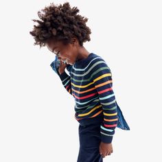 A sweater featuring our brightest rainbow that absolutely qualifies as dressed-up enough. And unlike most sweaters in the world, ours loves the washing machine. Made with a just-right fit that makes layering a breeze, and a slightly thicker knit for extra warmth. (Yeah, our entire team wishes this came in grown-up sizes, too.) Fabric: 100% cotton; pre-washed to minimize shrinkage. Machine washable. Feel: Dreamy soft with layer-friendly warmth, thanks to its slightly chunky knit. Learn more. Fit: Blue Crew Neck Top With Rainbow Print, Playful Crew Neck Top With Rainbow Print, Rainbow Striped Sweater, Rainbow Stripes Sweater, Playful Multicolor Long Sleeve Sweater, Family Pjs, Rainbow Stripes, Crewneck Sweater, Grown Up