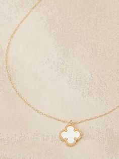 This delicate gold necklace features a double-sided clover charm, showcasing the iridescent beauty of mother-of-pearl on both sides. A timeless symbol of luck and love, this necklace is a beautiful and meaningful addition to any jewelry collection. Cute Pearl Necklace, Girly Christmas Gifts, Symbol Of Luck, Delicate Gold Necklace, Timeless Symbol, Clover Charm, Accessories Jewelry Necklace, Altar'd State, Jewelry Inspo