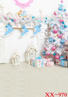 a white christmas tree with blue and pink ornaments