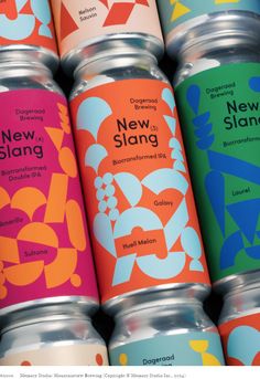 several cans of new slanta are stacked up in a row, with the same color and pattern on them