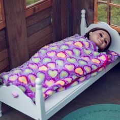 This adorable plush doll-sized sleeping bag is perfect for an overnight adventure with either your 15 inch doll or your 18 inch doll. Soft and cuddly purple plush background with multi colored hearts covers this adorable sleeping bag. Lined in soft purple fabric. Sized to fit 15 inch dolls to 18 inch dolls. Sleeping bag measures 10" W x 19" L. Also available in a pretty pink- sold separately. Exclusively made by The Queen's Treasures, offering the highest quality 18 inch Doll Furniture, 18 inch Play Doll, Kids Toy Shop, Fur Real Friends, Barbie Doll Set, Owl Plush, American Girl Dolls, Doll Play, Soft Purple, Purple Fabric