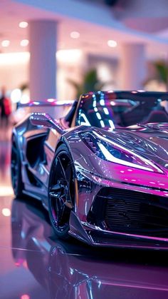 a futuristic car is shown on display in a showroom