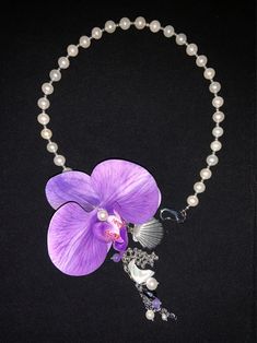 Butterfly Orchid Tassel Necklace | Jewelry | Three Fleas Trendy Purple Necklace For Gift, Trendy Purple Necklace For Gifts, Unique Clavicle Chain Choker For Gift, Unique Dangle Necklaces For Party, Artistic Choker Jewelry Gift, Artistic Choker Jewelry As A Gift, Artistic Choker Jewelry For Gifts, Unique Pendant Beaded Necklace, Unique Pendant Choker As Gift