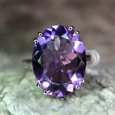 Discover the elegance of our designer natural amethyst ring, crafted in 925 sterling silver. This exquisite piece features a stunning natural amethyst gemstone, renowned for its deep violet hue and spiritual significance. The intricate designer setting showcases the gemstone's beauty while ensuring durability and comfort. Perfect for any occasion, this ring adds a touch of sophistication to your jewelry collection. Whether as a personal treat or a thoughtful gift, this amethyst ring is sure to i Luxury Amethyst Ring Gift, Elegant Amethyst Crystal Ring With Prong Setting, Luxury Purple Amethyst Ring In Sterling Silver, Elegant Amethyst Ring For A Gift, Elegant Formal Amethyst Crystal Ring, Amethyst Gemstone Rings For Formal Occasions, Amethyst Crystal Ring Fine Jewelry For Formal Occasions, Amethyst Crystal Ring Fine Jewelry For Formal Events, Formal Amethyst Rings With Large Stone