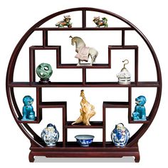 a circular shelf with various figurines on it