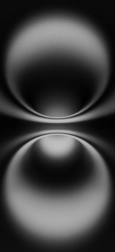 an abstract black and white photo with circles in the center, as well as some light