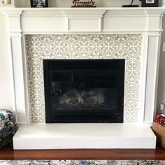 a white fireplace with a black fire place