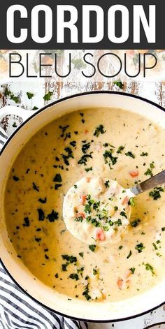 a white bowl filled with soup and garnished with parsley on the side