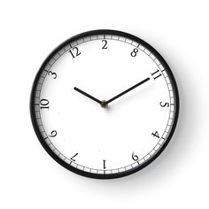 a black and white clock with numbers on it's face is shown against a white background