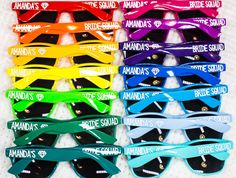 many colors of sunglasses with the words bride squad written on them in white letters and black frames