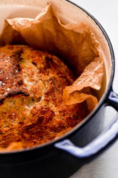 a pot filled with food sitting on top of a counter