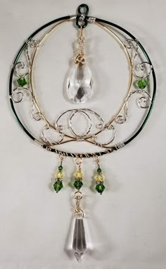 a necklace with green glass beads hanging from it