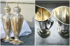 two silver vases sitting on top of a table next to each other and one has a spoon in it