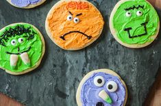 cookies decorated to look like monsters on a table