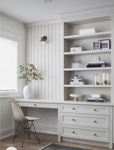 a white desk and chair in a room