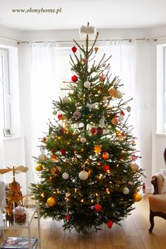 a decorated christmas tree in a living room