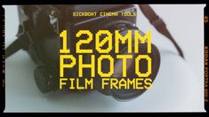 a camera with the words 120mm photo film frames in yellow on it's side