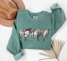 Western Sweatshirt, Horse Sweatshirt, Cowgirl Sweatshirt, Horse Girl T Sweatshirt, Ranch Girl Sweatshirt, Cowboy Shirt, Rodeo Sweatshirt Luxurious comfort and style are what this unisex, garment-dyed sweatshirt is all about. It's made with 80% ring-spun cotton and 20% polyester and the fabric is 3-end garment-dyed, ring-spun, color-blast fleece with a 100% cotton face. Each sweatshirt comes with a relaxed fit, a rolled-forward shoulder, and a back neck patch.  .: 80% ring-spun cotton, 20% polyes Sweatshirt And Shirt Outfit, Ranch Girl, Western Horses, Western Sweatshirts, Casual Country Outfits, Horse Sweatshirts, Country Style Outfits, Western Wear Outfits, Cute Country Outfits