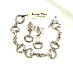 Susan Shaw New With Tag Equestrian Jewelry Set. Silver Tone Horse Bridle Bit Bracelet & Earrings Set New With Tag. Perfect For All Of My Equestrian Loving Friends. These Were Purchased At The Devon Horse Show Years Ago And I Never Wore Them. So I’m Letting Them Go To A New Home. They Both Are New But Have A Slightly Aged Patina From Hanging Around. If You Wanted To Buy These From Susan They Would Cost $135 For The Two Pieces. I Am Selling Them As A Set For $100. Equine Jewelry Bracelets, Horse Jewelry Handmade, Equestrian Jewelry Ashley's Equestrian Jewelry, Horse Jewelry Ashley's Equestrian Jewelry, Horse Jewelry Earrings, Elegant Sterling Silver Jewelry For Shows, Elegant Adjustable Jewelry For Shows, Equine Jewelry, Chunky Silver Jewellery