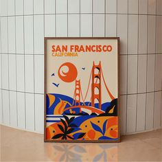 a san francisco poster on the wall next to a tiled bathroom area with white tiles