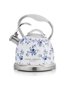 a blue and white tea kettle with flowers on it