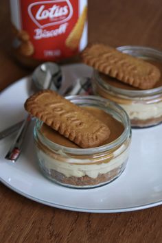 two desserts with peanut butter and graham crackers on a plate next to a can of soft drink