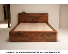 a bed made out of wood with no sheets