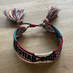 Christian Dior Embroidered Friendship Bracelet With Tassel Ends, Adjustable, New Without Tags In Great Condition Adjustable Embroidered Multicolor Bracelets, Designer Adjustable Red Bracelets, Bracelet Dior, Embroidered Bracelet, Fabric Bracelets, Dior Jewelry, Friendship Bracelet, Womens Jewelry Bracelets, Embroidered Friendship Bracelet