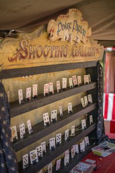 a display case with cards on it in front of a red and white table cloth