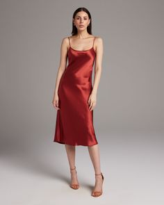 Bias cut Midi Slip Dress elegantly drapes on the body. This perfect basic can be worn for life, dressed up, or dressed down, for the perfect ensemble. Style with a sweater and boots in the Fall or wear with sandals in the Summer. 100% Silk Charmeuse Made in New York City Product Care: Dry Clean Only Dress Elegantly, Minimalist Outfits, Warm Dresses, Convertible Dress, Midi Slip Dress, Poncho Tops, Silk Tank, Silk Charmeuse, Wrap Blouse