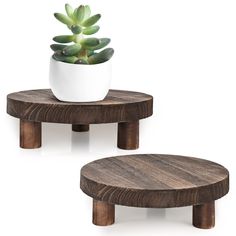 two small wooden tables with plants in them