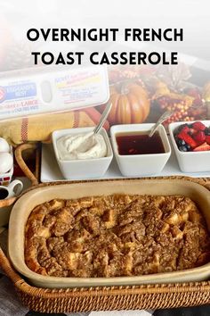 overnight french toast casserole with berries and whipped cream in the background, on a wicker tray