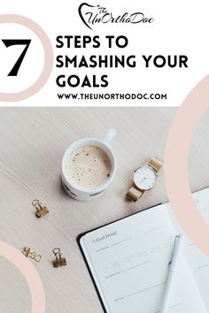 a cup of coffee on top of a desk next to an open notebook with the title 7 steps to smashing your goals