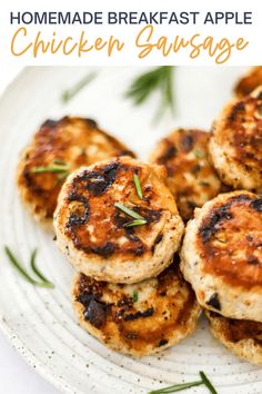 homemade breakfast apple chicken sausage patties on a white plate with rosemary garnish