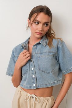 Unleash your inner free spirit with our High Horse Cropped Denim Shirt. Made from soft denim fabric, this shirt exudes effortless style with its cropped length and oversized fit. Perfect for any occasion, the snap button closure and short sleeves add a touch of convenience to this versatile piece. Get ready to ride in style. denim fabric // cropped length // short sleeves // oversized fit // snap button closure We always recommend ordering your true size. Cropped Denim Shirt, High Horse, People Poses, Denim Outerwear, Cropped Denim, Light Denim, Crop Shirt, Denim Fabric, Look Cool