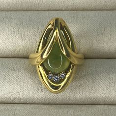 Vintage Grosse Germany 1973 | 14k Gold Ring | Jade Stone With Diamonds | Size 3.5 | Formal Yellow Gold Diamond Ring With Gemstone, Collectible Yellow Gold Emerald Cabochon Ring, Collectible Yellow Gold Emerald Ring With Cabochon, Fine Jewelry Yellow Gold Emerald Ring For Collectors, Exquisite Yellow Gold Collectible Rings, Collectible Multi-stone Yellow Gold Diamond Ring, Formal Marquise Yellow Gold Emerald Ring, 14k Yellow Gold Pear-shaped Emerald Ring, Unique Oval Yellow Gold Diamond Ring