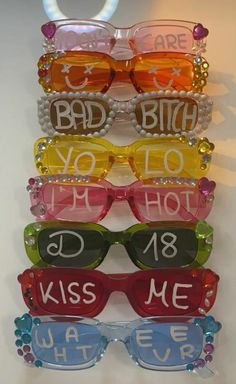 six pairs of sunglasses with the words'i love you to kiss me'written on them