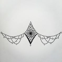 a drawing of an ornamental design on white paper