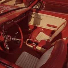 the interior of an old car is red and white