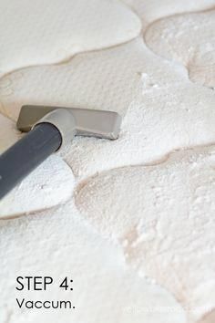 a close up of a mattress with a knife in it's center and the words step 4 vacuum on top