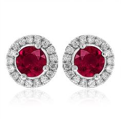 Filled with a rich, warm fiery red, this pair of well-matched Natural Rubies will add color to any outfit. Weighing 1.01 carats these round gems have been cut to reveal and even color coupled with a light lustrous tone. The floral inspired 14K white gold mounting adds grace and style, maintaining this pairs resilience. Red Gemstones, Ruby Earrings, Fiery Red, White Gold Earrings, Ruby Gemstone, Red Ruby, Stunning Earrings, Natural Ruby, Fine Jewellery Earrings