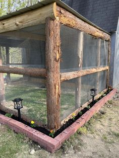 a chicken coop built into the side of a house