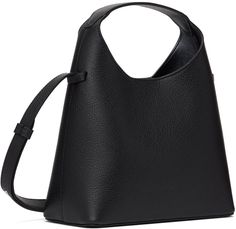 Grained calfskin shoulder bag in black. · Integrated carry handle · Adjustable and detachable crossbody strap · Logo graphic embossed at face · Magnetic closure · Card slot at interior · Grained faux-leather lining · H10.5 x W9 x D4 Supplier color: Grain black Medium Black Bag With Detachable Handle, Eco-friendly Black Shoulder Bag With Double Handle, Black Shoulder Bag With Adjustable Handle For On-the-go, Black Shoulder Bag With Snap Closure For On-the-go, Black Leather Shoulder Bag With Silver-tone Hardware, Adjustable Bag, The Bag, Black Bag, Black Mini