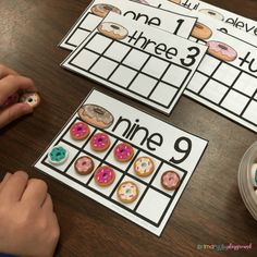 a table with doughnuts and numbers on it