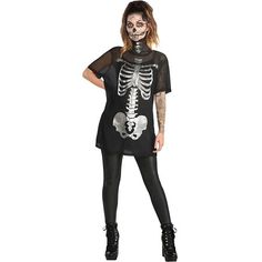 a woman wearing a skeleton shirt and leggings with her hands on her hips